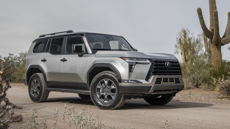 Silver 2026 Lexus GX parked on a desert road