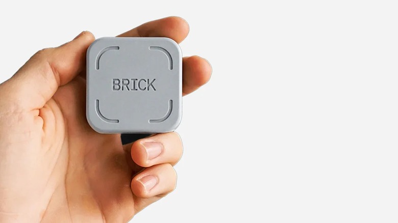 Hand holding Brick NFC device