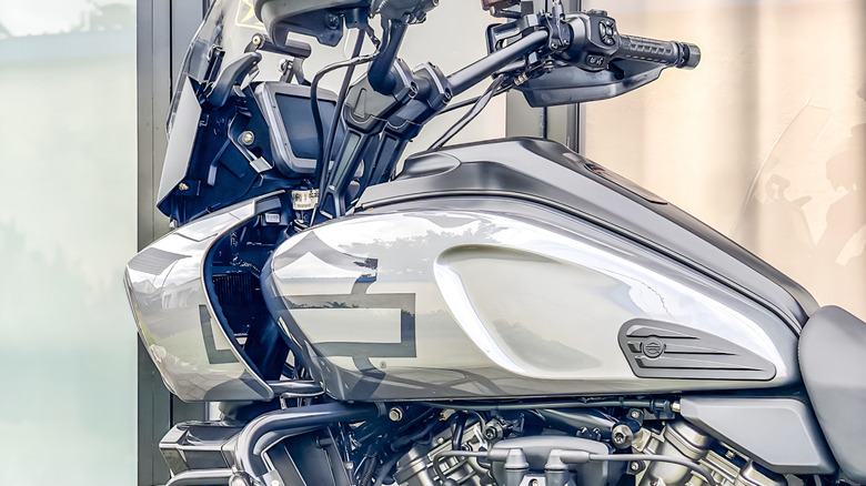 An up-close shot of the fuel tank on a gray Harley-Davidson Pan America