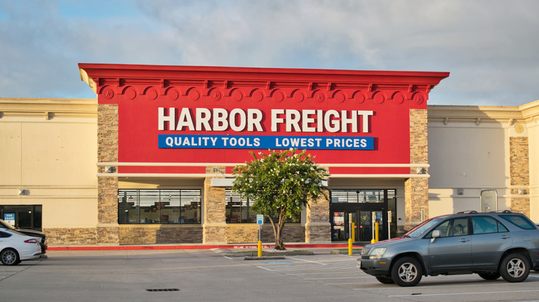The exterior of a Harbor Freight store on a cloudy day with cars parked in front