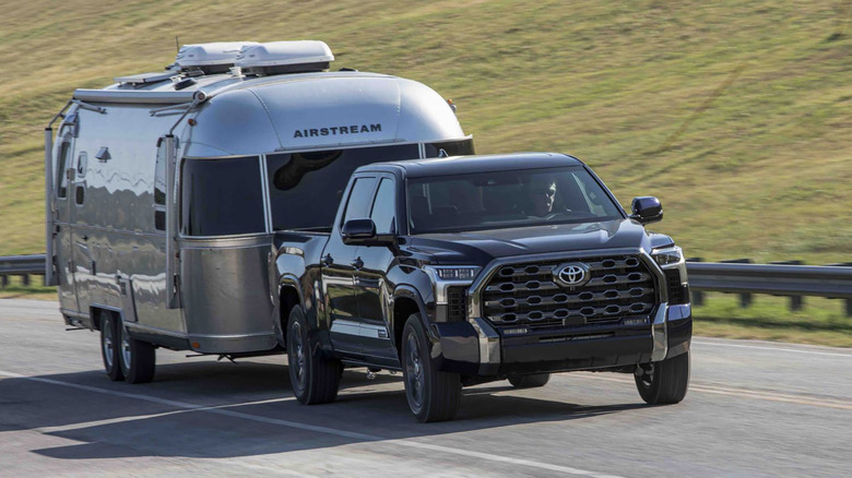 Black Toyota Tundra towing trailer