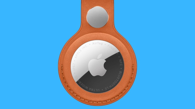 Second-generation Apple AirTag against blue background