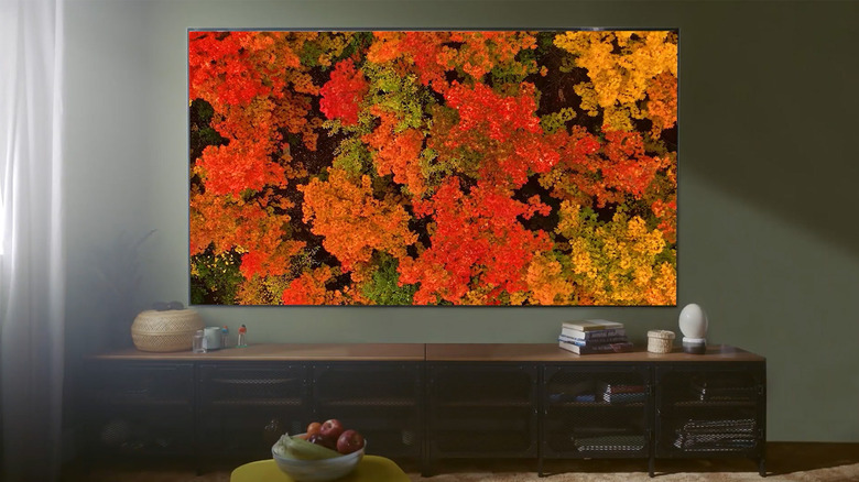 An LG OLED TV hanging on a wall