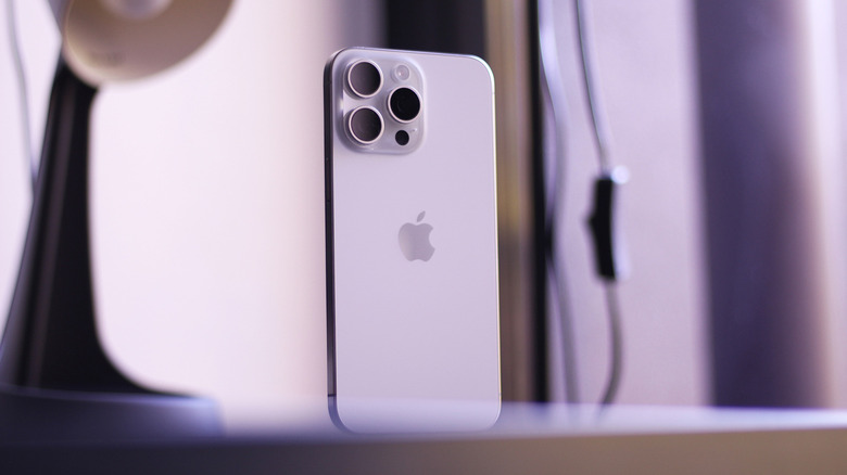 White iPhone 15 Pro Max on a desk