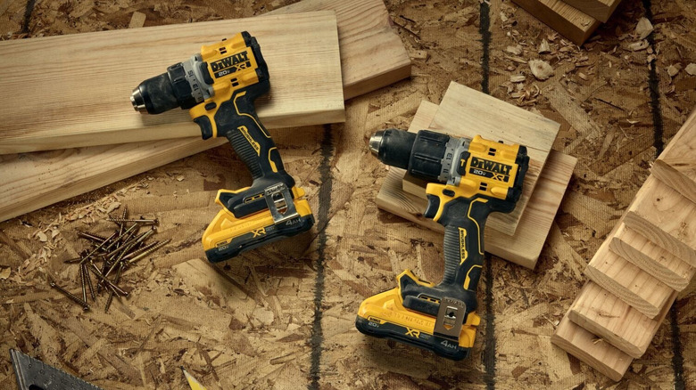 DeWalt 20V Max XR Drills placed near wooden blocks and carpentry equipment