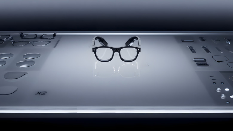 Ray Neal Glasses on glass table with other parts
