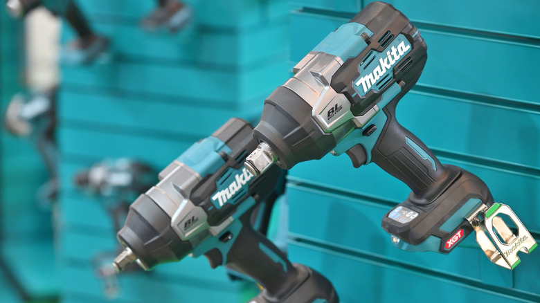Two Makita XGT for sale drills in a store.