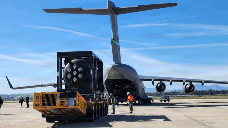 A Ward 250 nuclear microreactor positioned for loading into the back of a C-17 Globemaster III aircraft.