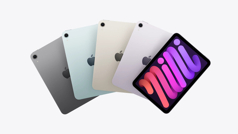 Five iPads next to each other on a white background.