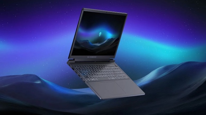 Alienware laptop open and floating with a colorful backdrop.