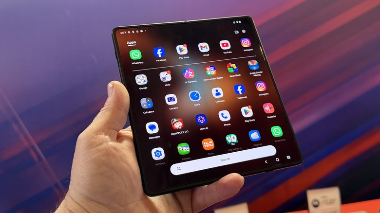 Man holding Moto Razr Fold