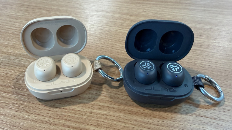 Two generations of JBuds Mini on a table