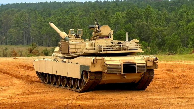 M1 Abrams tank with main cannon elevated.