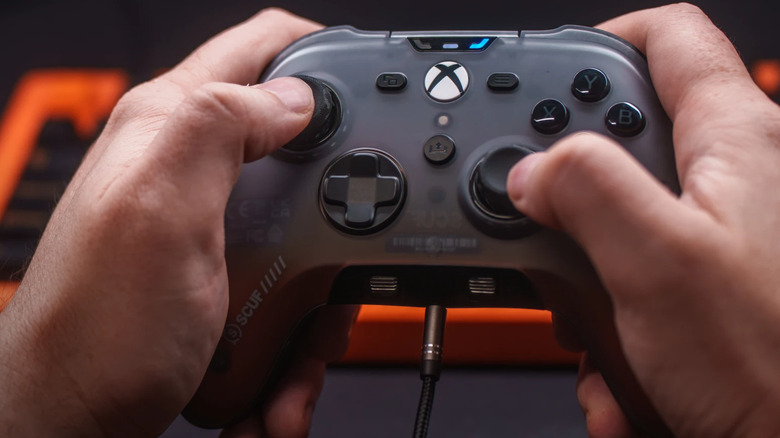 Person playing games on Scuf Valor Pro Wireless controller