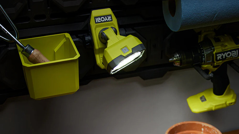 Ryobi USB Lithium clamp light illuminating a workspace