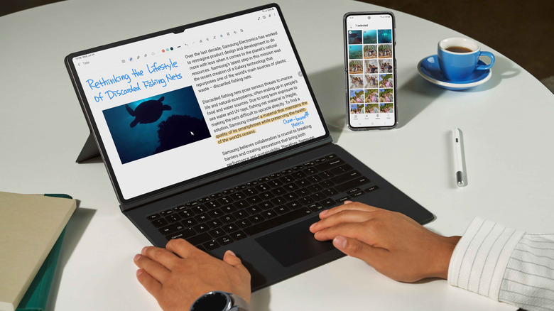 Samsung Galaxy Tab S9 Ultra with Book Cover Keyboard on table with Galaxy smartphone