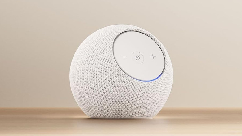 An Amazon Echo Dot on a table.