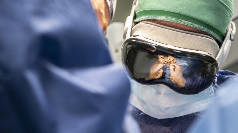 a doctor using an Apple Vision Pro during an operation