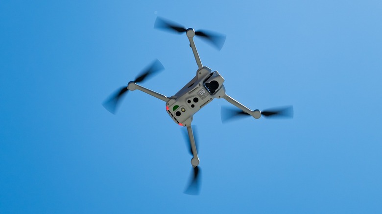 The underside of the Antigravity A1 flying in a blue sky.