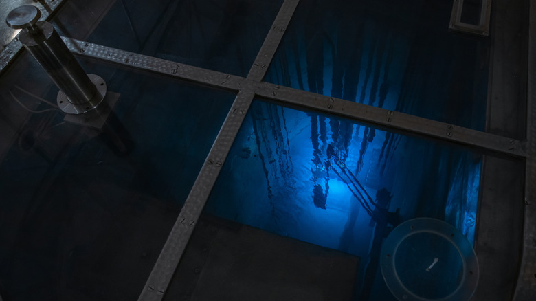 Blue glowing water caused by Cherenkov radiation.