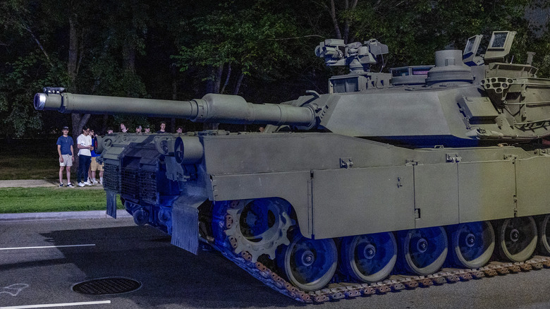 An Army M1 Abrams tank moves along Independence Ave.
