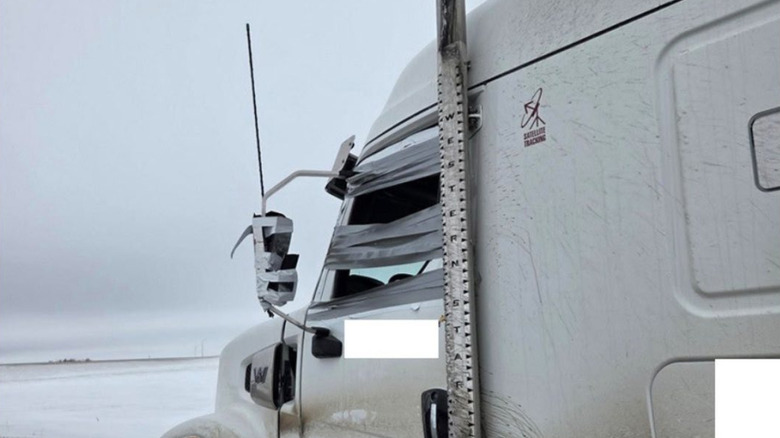 The duct taped truck pulled over by the police