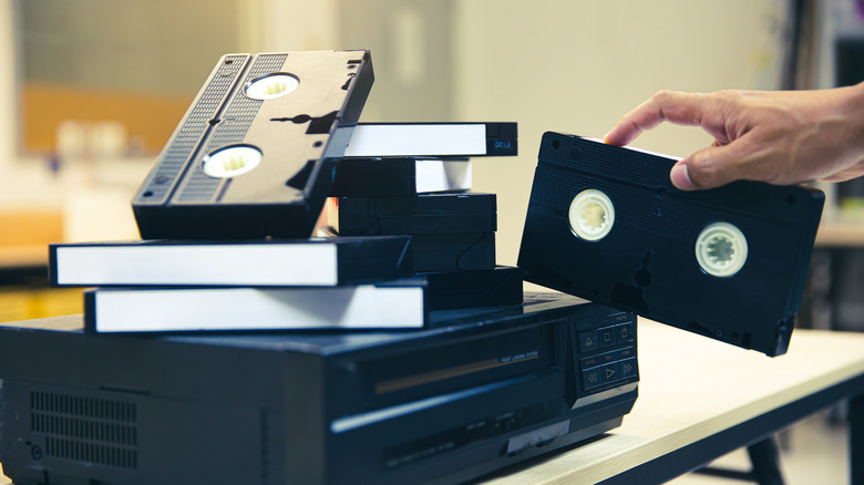 VHS tapes on top of a VCR