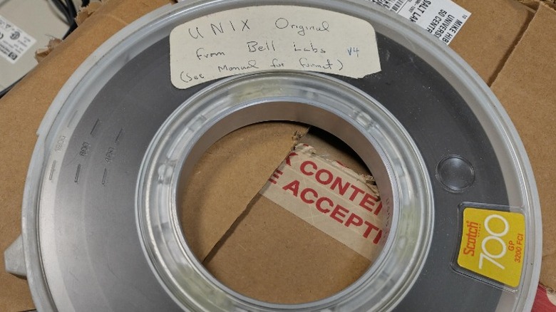 A spool of magnetic tape with a label indicating that it contains Unix V4