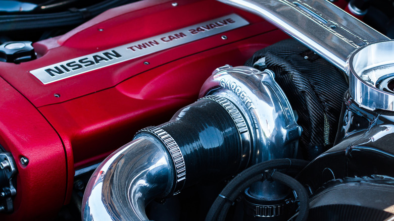Close-up of Nissan RB26DETT turbocharged engine showing Garrett turbocharger