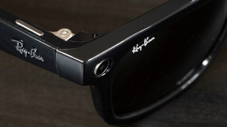 Close-up shot of a pair of black Meta Ray-Ban glasses in Wayfairer style against a dark background